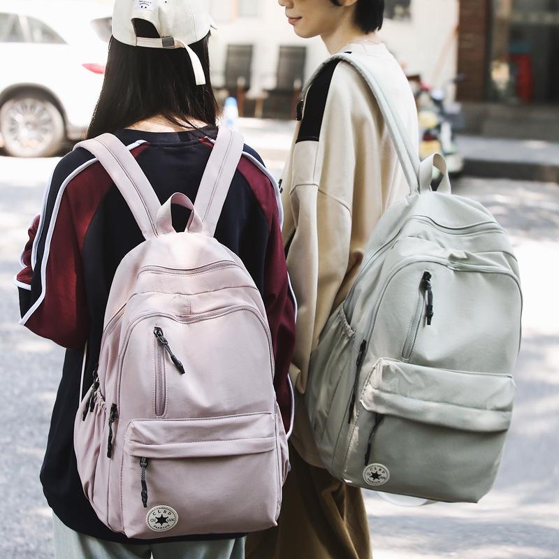 Niche Lightweight Nylon Backpack: Large-Capacity, Casual, Unisex Shoulder Bag for Commuters and Students