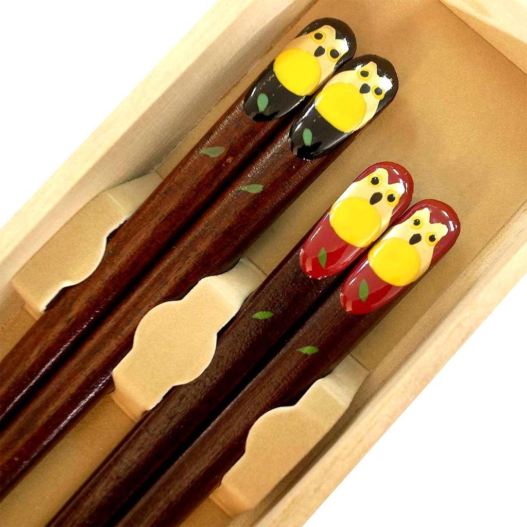 A pair of matching chopsticks featuring a golden owl presented in a paulownia wood A perfect gift for wedding anniversaries wedding Respect for the