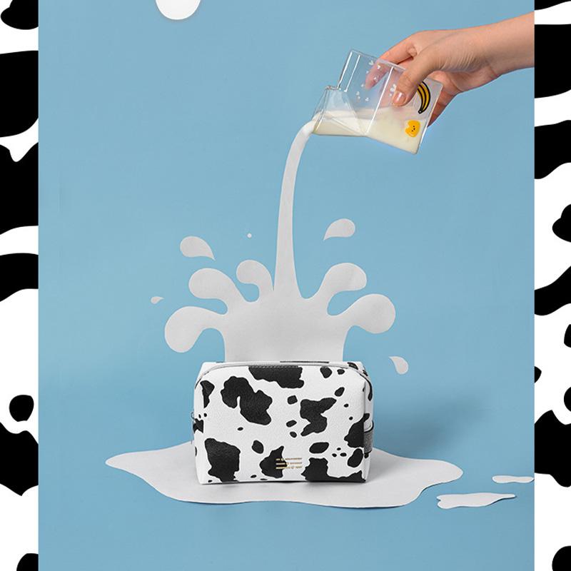 Portable Makeup Bag Cow Print Waterproof PU Toiletry Bag Fashionable Zipper Makeup Pouch for Travel