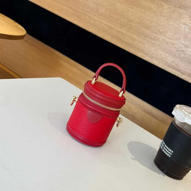 

2025 Новая женская сумка из натуральной кожи, цилиндрическая вертикальная мини-сумка-ведро для ланча, сумка для наушников на цепочке, косметичка, партия из трансграничной партии 10x8CM красный