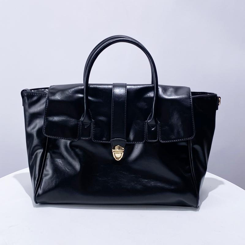Luxury Women's Briefcase Designer Bag and Bag New In PU Leather Vintage Simple Large Capacity Lock Displacement Lady Tote