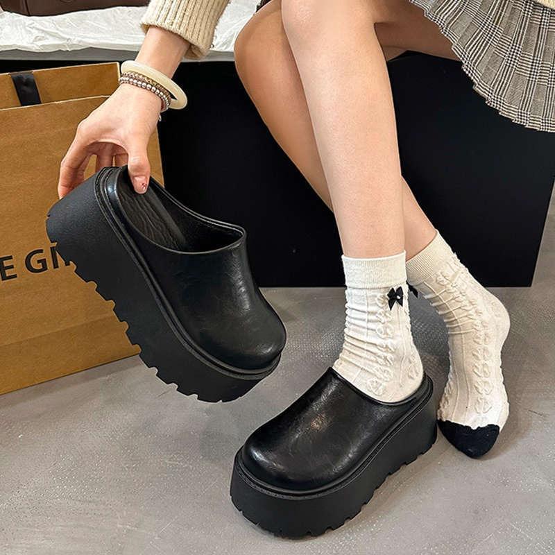Height-increasing thick-soled slippers women's outer wear summer new super hot Internet celebrity black high-heeled half-support bag head slippers