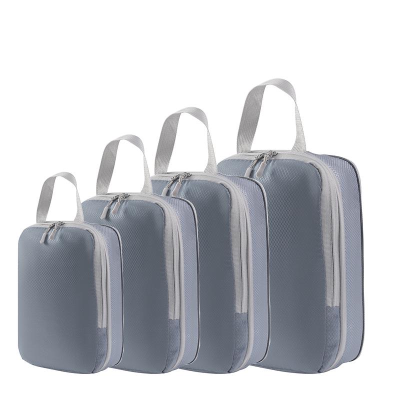 

Набір з чотирьох компресійних дорожніх мішків: Організатор для одягу та туалетних речей