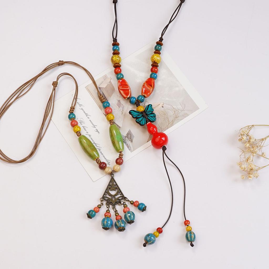 Ethnic style ceramic butterfly bell pendant necklace design sense new trendy long sweater chain