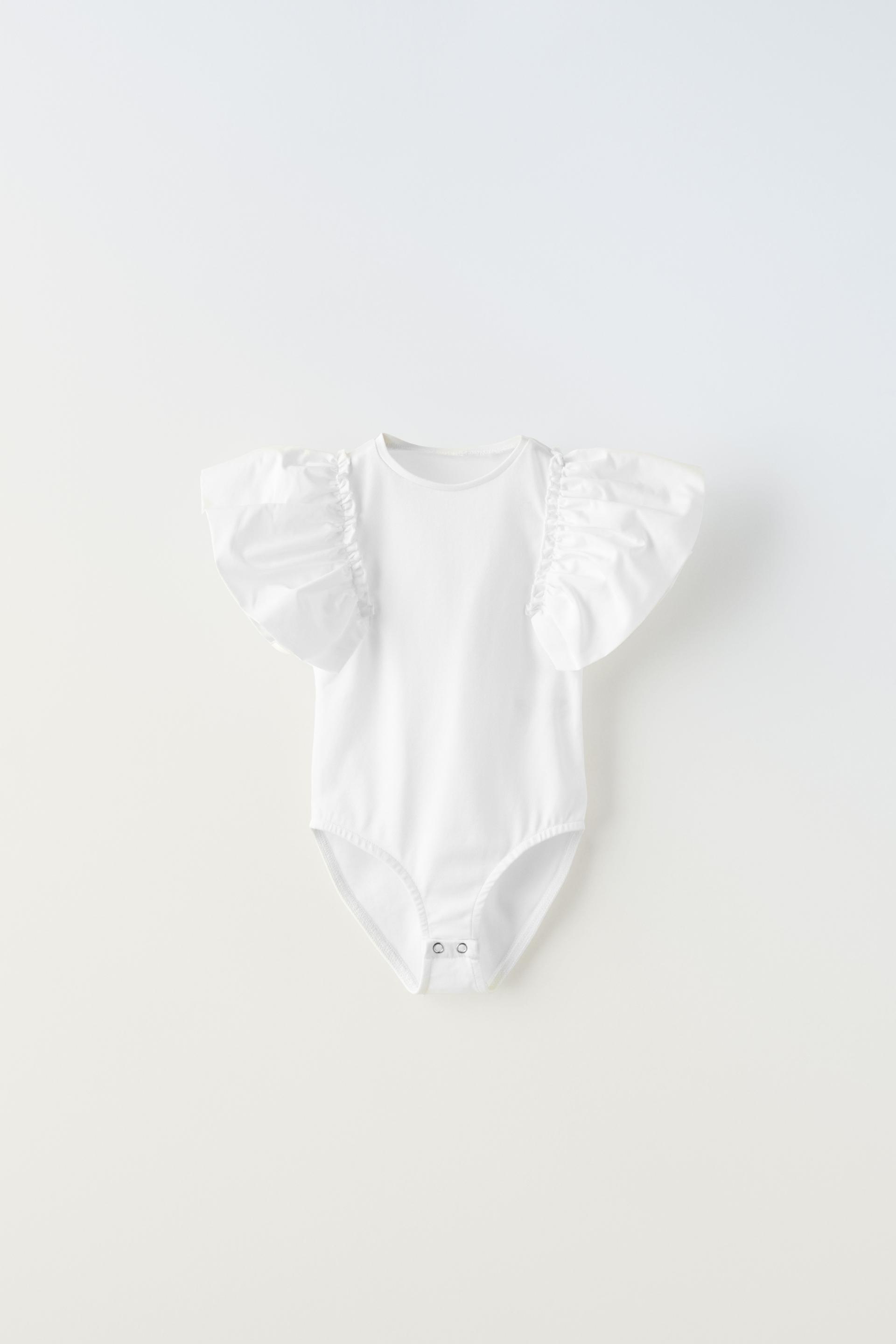 

ФУТБОЛКА С ПРИНТОМ РОМАШКИ