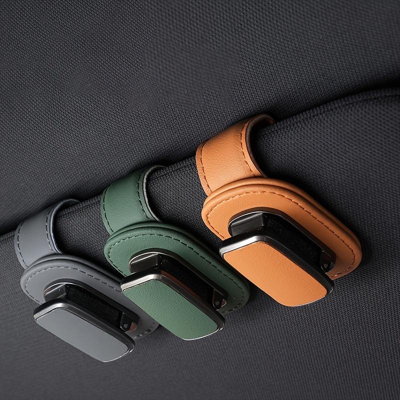 Heavy-duty PU leather car sun visor clip and eyewear holder—a one-click dashboard organizer compatible with smartphones.