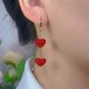 Elegant Red Heart Tassel Earrings: Slim, Sweet, and Stylish for a Round Face.