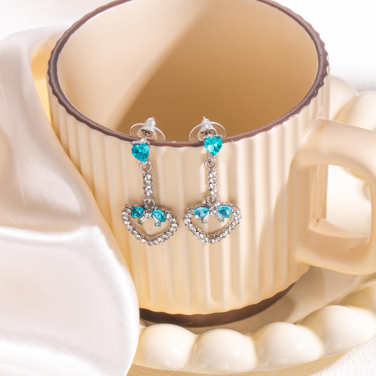 Silver Needle Hollow Heart Tassel Earrings with Blue Diamond Inlays - Elegant and Unique Design