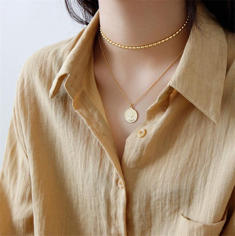 Collier ovale rétro français à perles pour femmes: Chaîne clavicule simple, luxueuse, polyvalente à plusieurs rangs