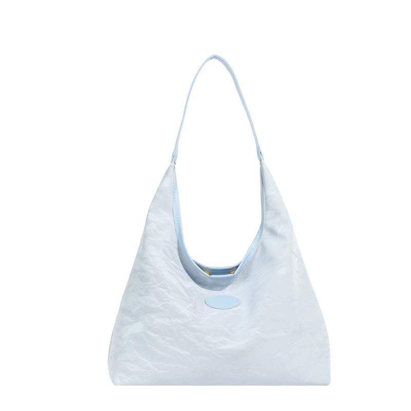 

Korean version soft surface large capacity tote bag women s gentle casual shoulder bag design sense personalized commuter armpit bag синій