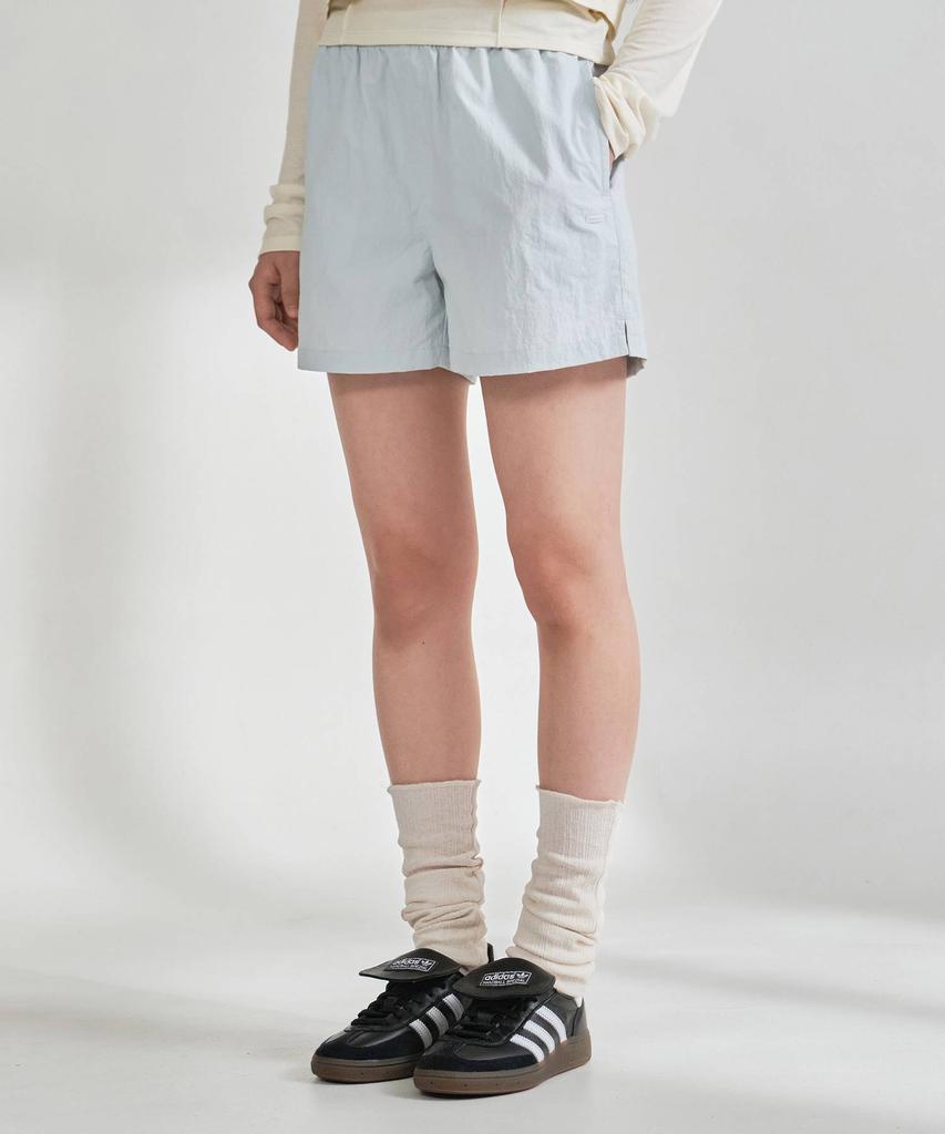 COVERNAT WOMAN Sheer Nylon Windbreaker Shorts Light Blue