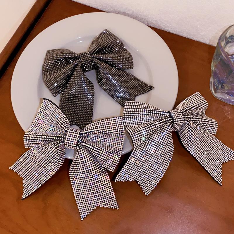 Korean version of fashion bow hairpin niche simple and versatile temperament spring clip advanced semi-drape hairpin