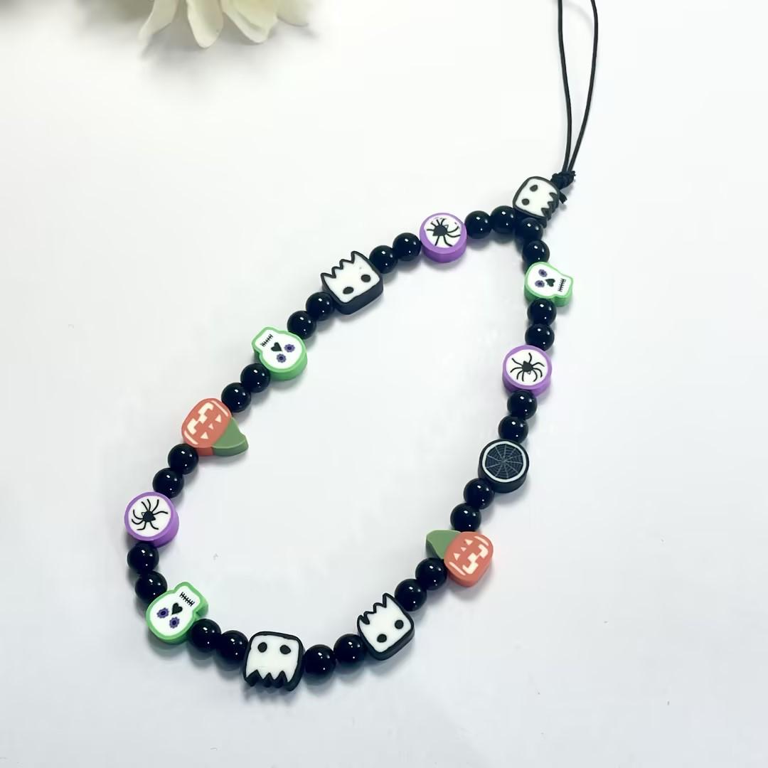 

Festive Polymer Clay Letter Phone Charm with Pearl and Stone Accents