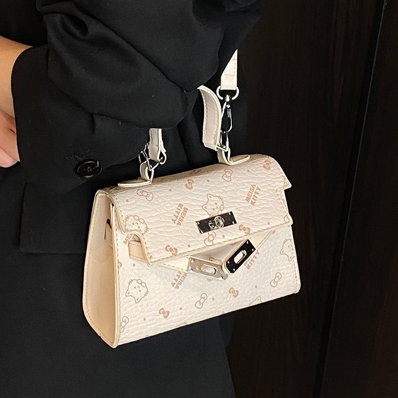 This year, the Korean version of the popular temperament cute printed portable Kelly bag niche light luxury versatile foreign style messenger wom