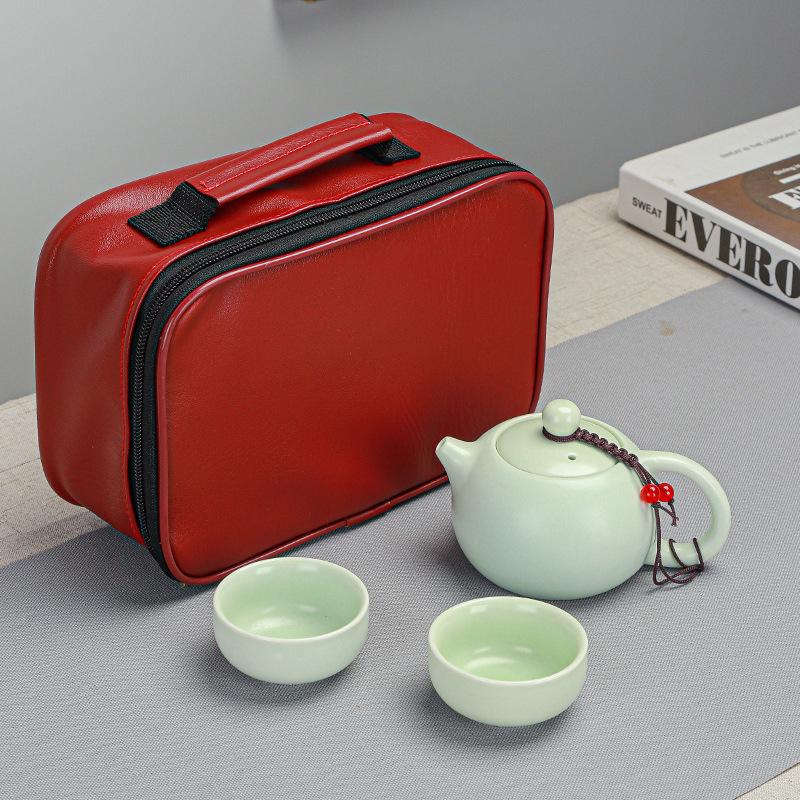 

Convenient travel kung fu tea set, one pot and four cups of express red leather bag, simple package.