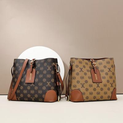 Nieuwe dameshandtassen voor lente en zomer, retro letterprint, draagbare emmer tas, hoogwaardige contrasterende kleur tote bag, schouder crossbody tas.
