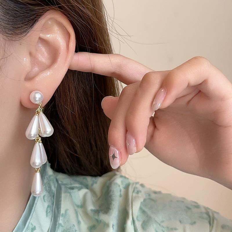 Luxuriöse lange Ohrhänger mit Imitationsperlen für Damen, modisch, elegant, Mückenabwehrspule, Ohrklemme ohne Piercing