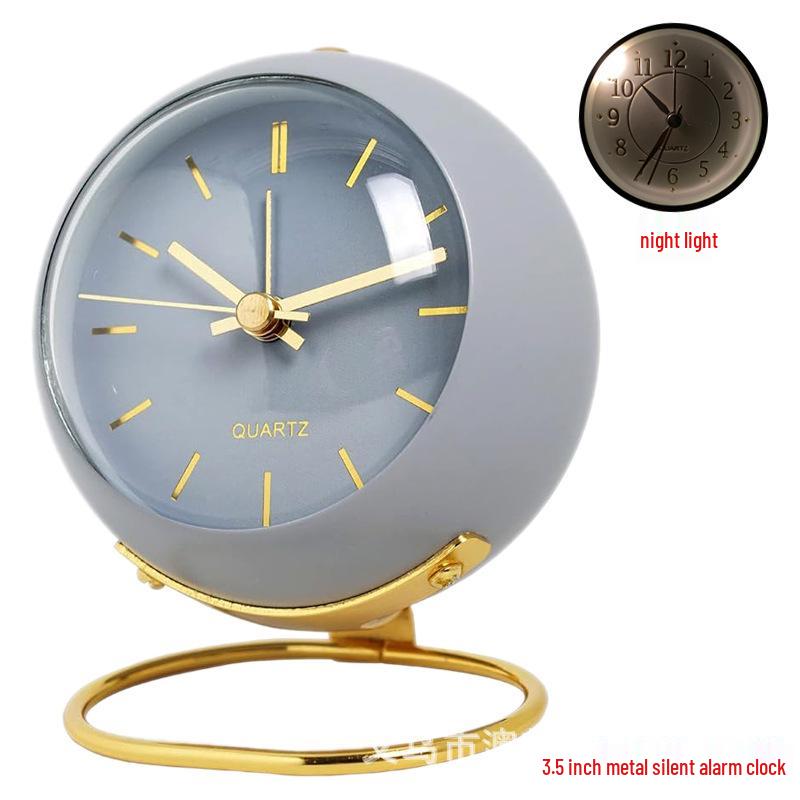 Silent Metal Alarm Clock with Night Light and Gold Stamped Spherical Face - Perfect for Students and Children.