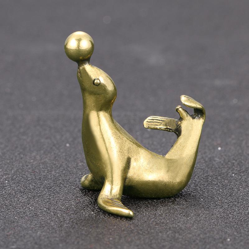 Brass Sea Lion Figurine With Vintage Crafted Design And Balancing Ball Detail Perfect For Home Desk Decor Small Gifts Collection