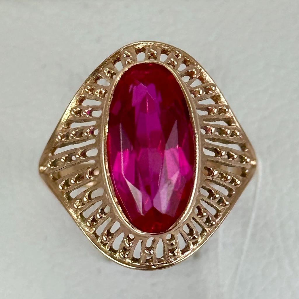 Vintage Hollow Copper Ring with Oval Red Artificial Gem for Women, Suitable for Banquets and Formal Occasions.
