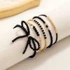 5 fashionable and simple black glass bead bow bracelet with adjustable braided bead bracelet set