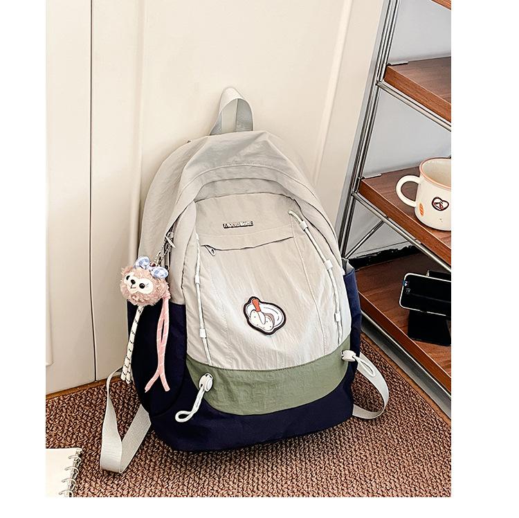 Simple schoolbag, Korean contrasting colors, new schoolbag, light travel and leisure backpack, high value, dirt-resistant