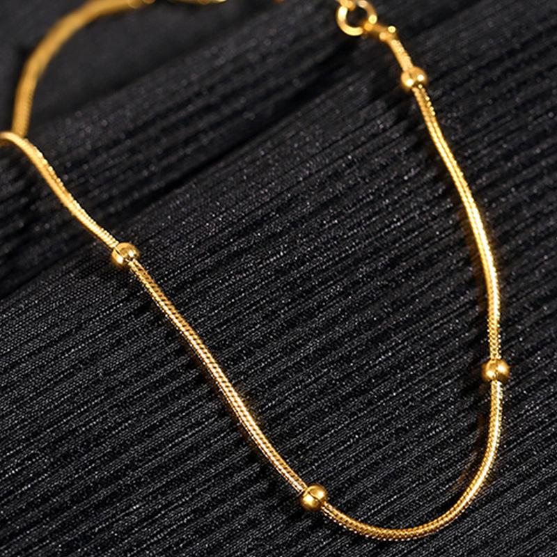 Gold-Tone Titanium Steel Snake Chain Bracelet with Beads - Non-fading, Simple Design for Women.