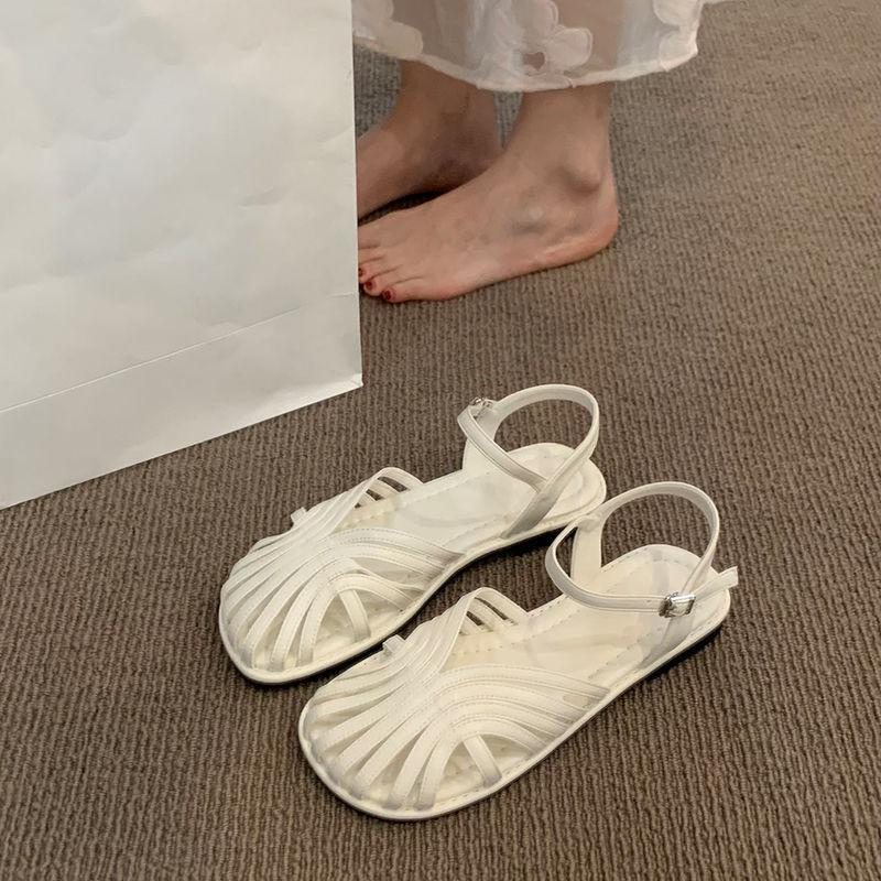 Mori baotou sandals female 2025 summer new fairy wind woven Roman shoes hollow flat bottom pig cage beach shoes
