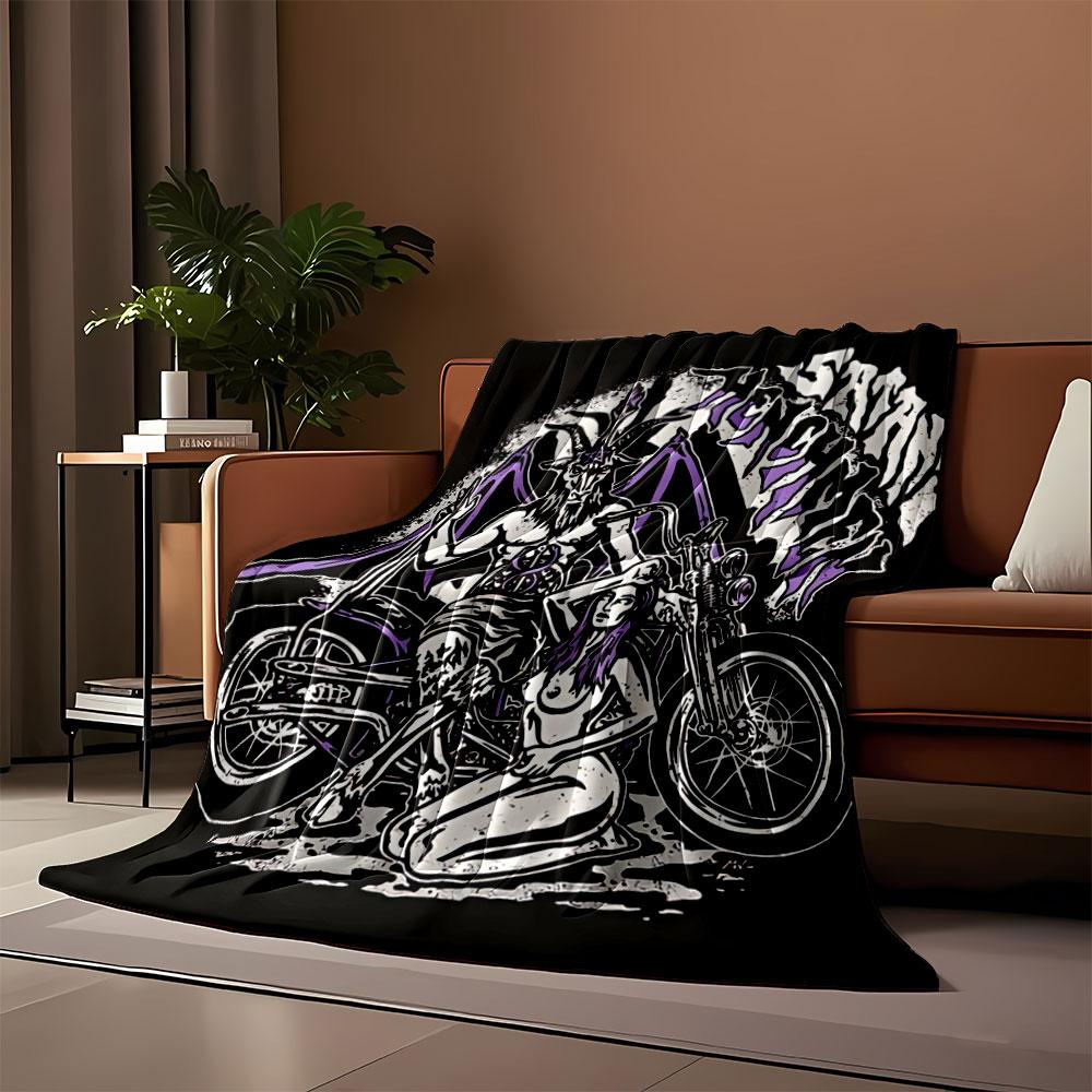 A goat-headed figure with wings and a seated woman beside a motorcycle. for all seasons blanket lunch break throw gift