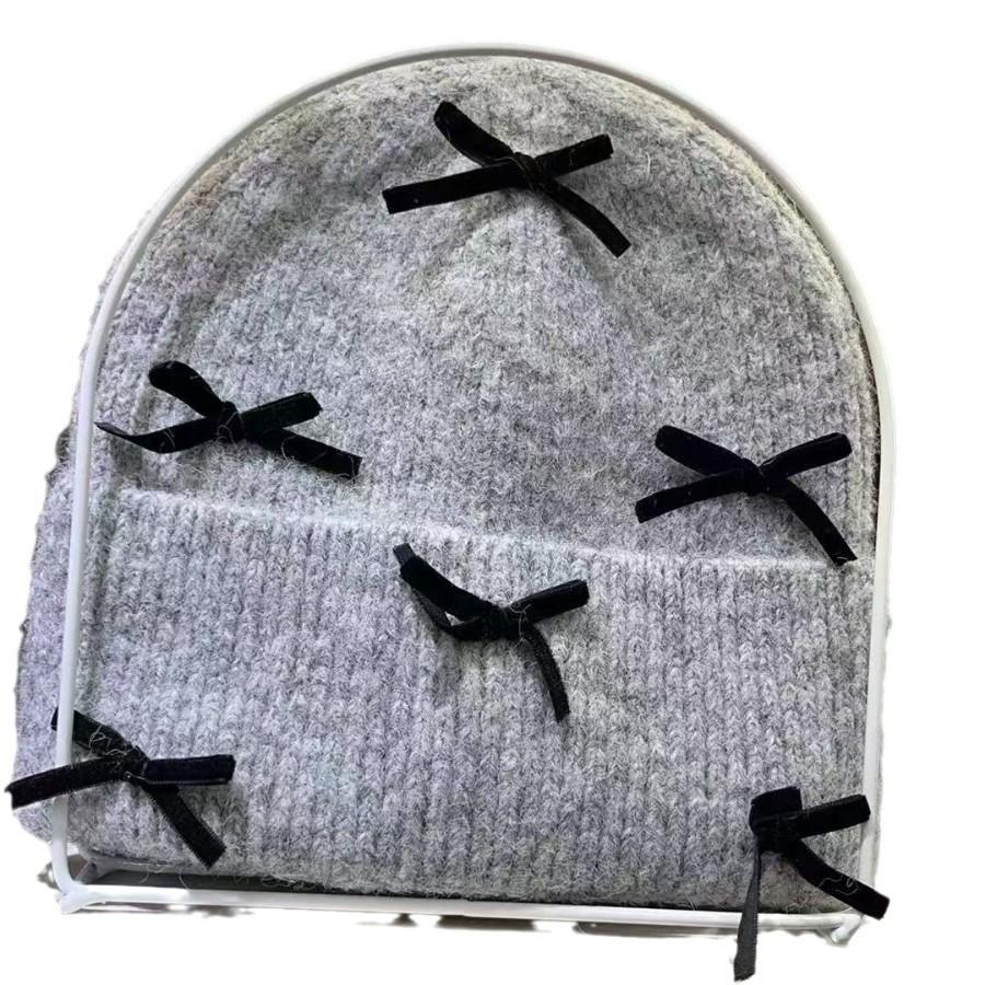 Korean ins autumn and winter warm sweet wool hat women contrasting color bow knitted ear protector face small pile hat tide