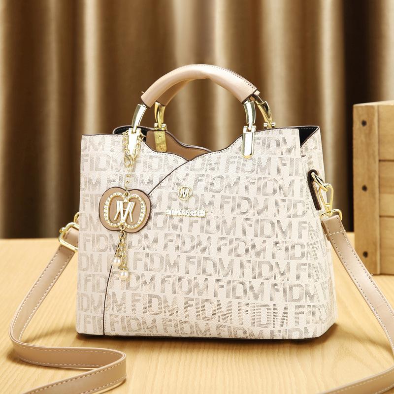 

Європа красива жіноча сумка 2025 нова мама велика місткість велика сумка портативна універсальна на плече месенджер жіноча сумка