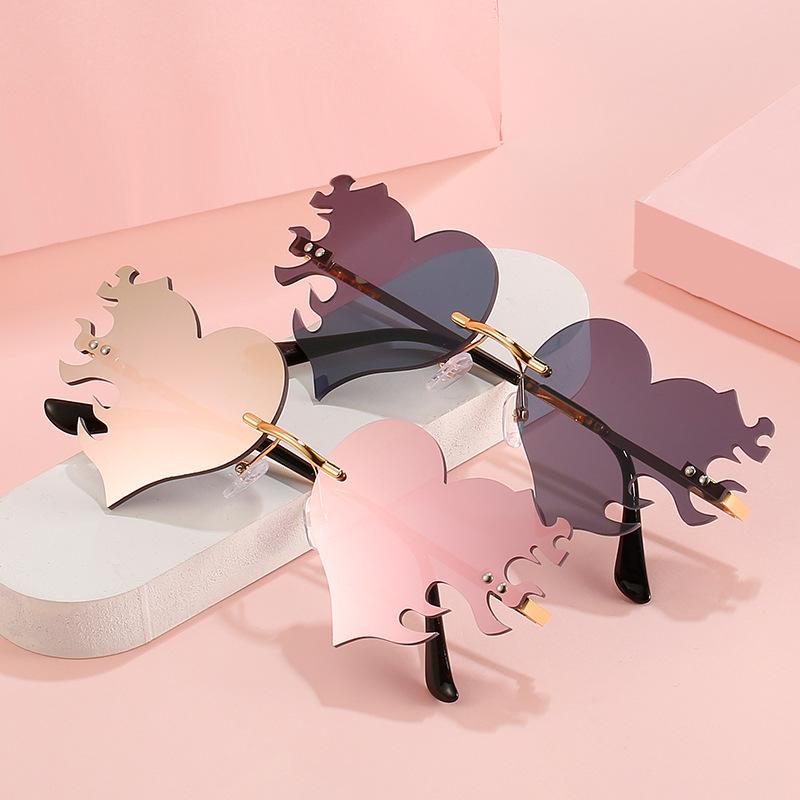 

Уникальные солнцезащитные очки в форме сердца для женщин, модные солнцезащитные очки без оправы с защитой UV400, модные уличные очки с защелкой, подарок на вечеринку