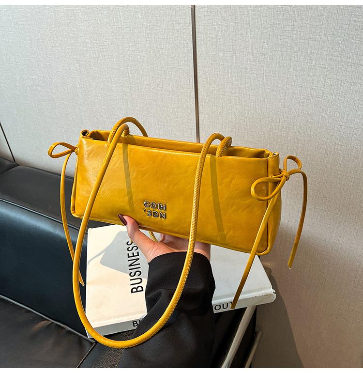 

Handheld small bag women 2025 new fashion retro underarm baguette bag French niche commuter shoulder bag жёлтый