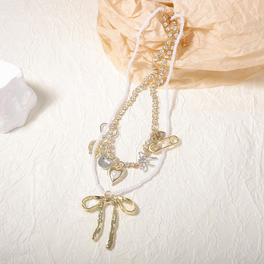 Fashion niche creative design sense double-layered alloy bow pendant necklace versatile temperament model