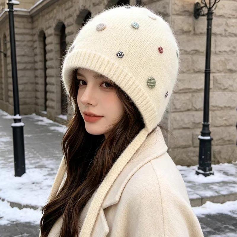 Autumn and winter Angola rabbit fur ear protection knitted hat women's color button decorative lace-up wool hat outdoor cold hat tide