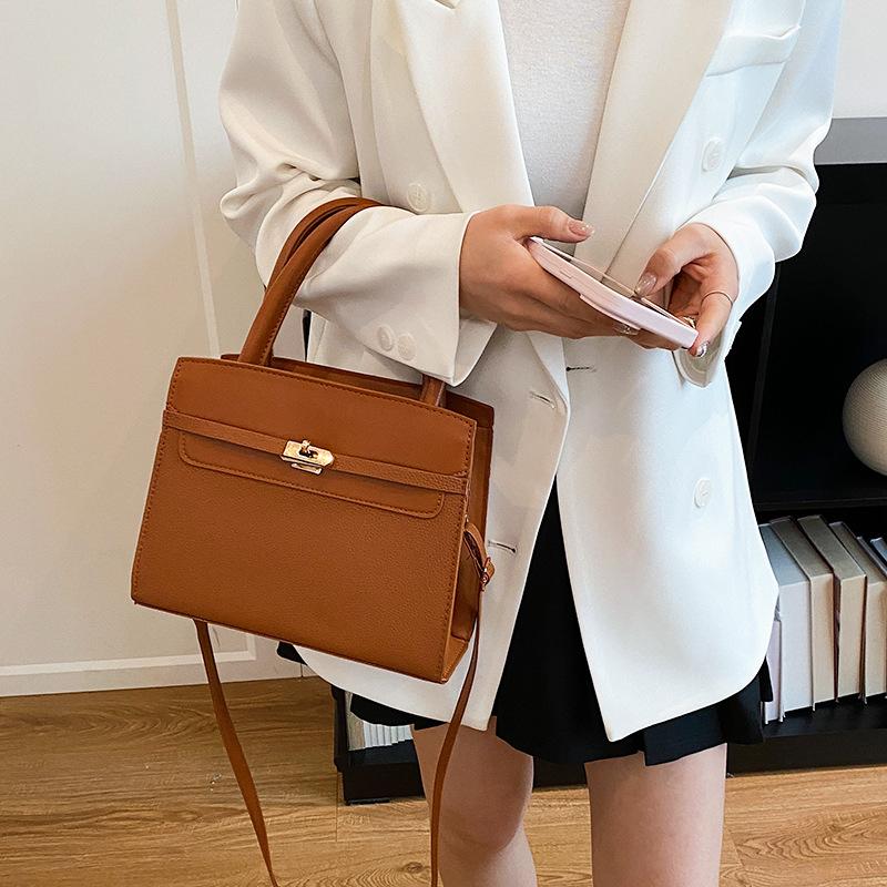 Bolsos de mujer extranjeros, elegantes y sencillos, portátiles, bandoleras cruzadas casuales de gran capacidad, versátiles, bolsos de empalme de contraste de color de alta gama