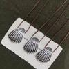 Elegant Silver Seashell Pendant Necklace with Brown Leather Cord
