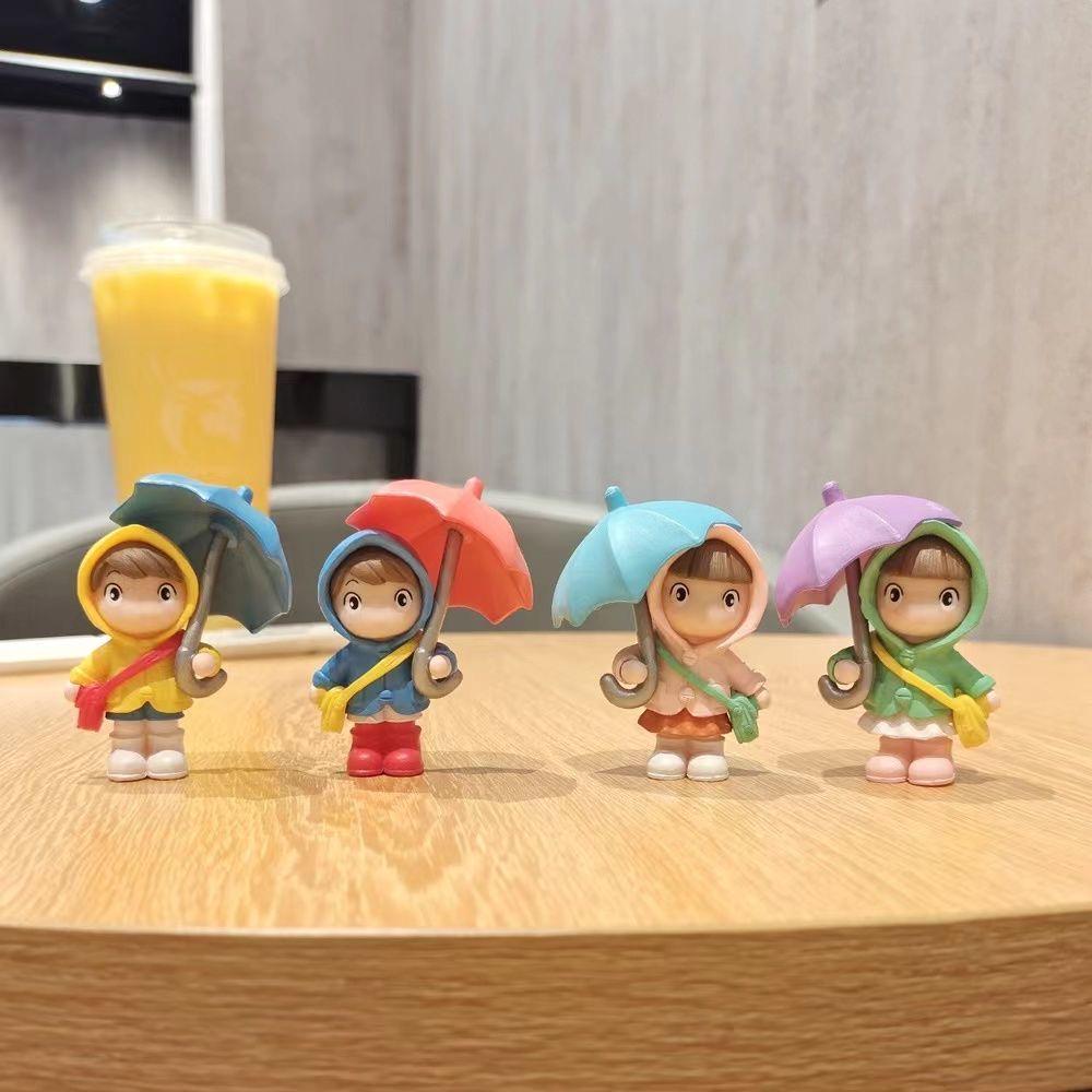 Cartoon Character Desk Ornament: Cute Umbrella-Holding Figure for Creative Office Decor