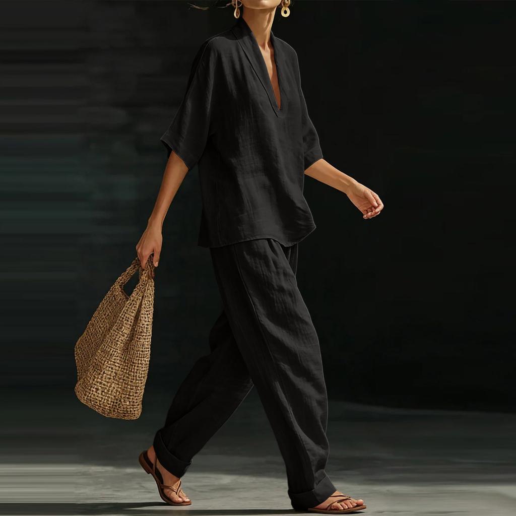 Damset med V-ringad pullovertopp och lös midja, avslappnad