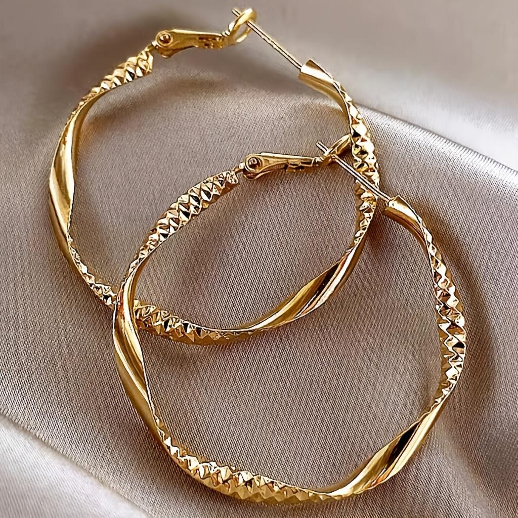 Fashionable and simple round twisted irregular ladies earrings exaggerated girls earrings high-grade plain hoop earrings