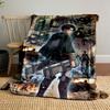 A Character with Gear Faces Dynamic Battle Scenes and Towering Titans. for All Seasons Blanket Lunch Break Throw Gift