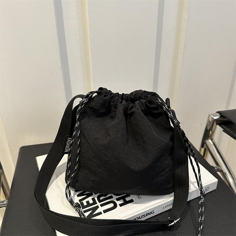 Trendy Large Capacity Women's Casual Shoulder Bag | Solid Color, Drawstring Closure, Polyester Lined, Durable Material, Korean Fashion