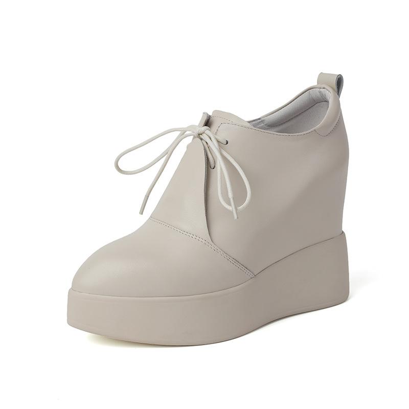 Wedge heel thick-soled leather single shoes women's 2025 new 12cm inner height increase pointed waterproof front strap-on deep mouth single shoes