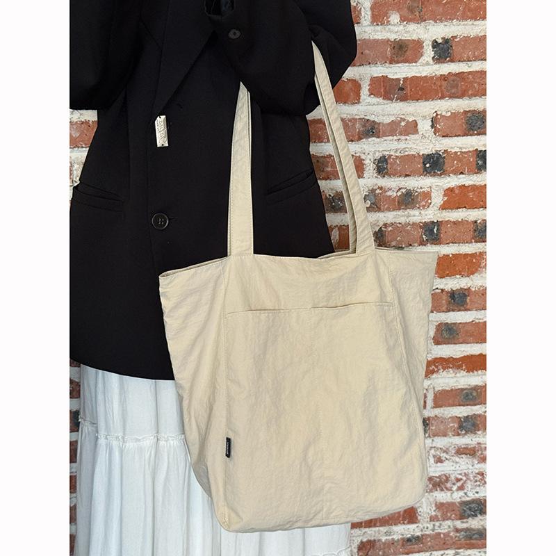 Korean simple solid color canvas bag women's 2025 new large-capacity lightweight shoulder tote bag versatile commuter bag