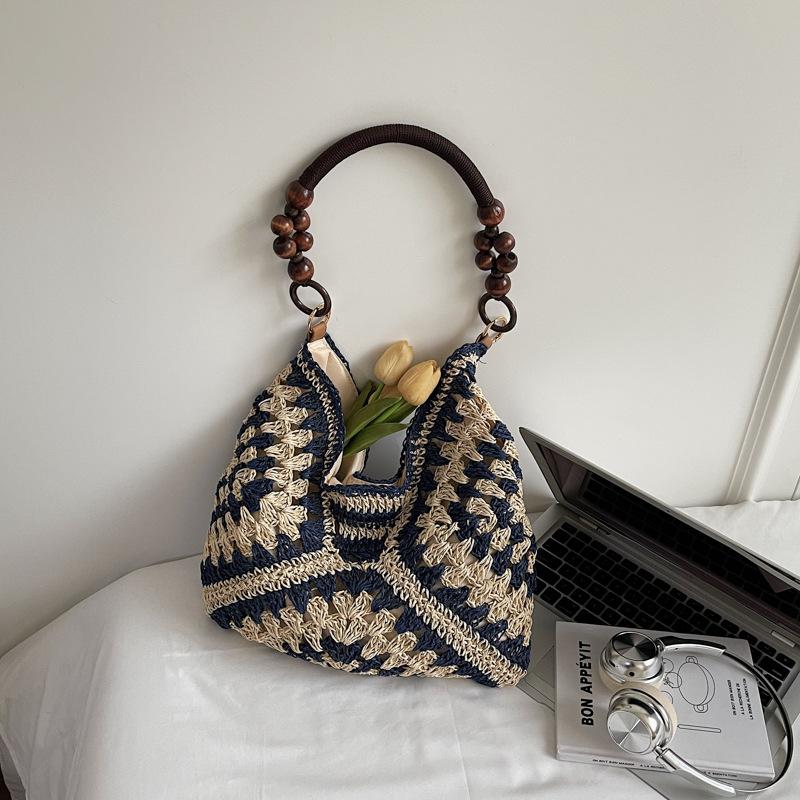 

Hollow straw woven bag women s new summer shoulder tote bag seaside vacation beach woven bag темно-синий