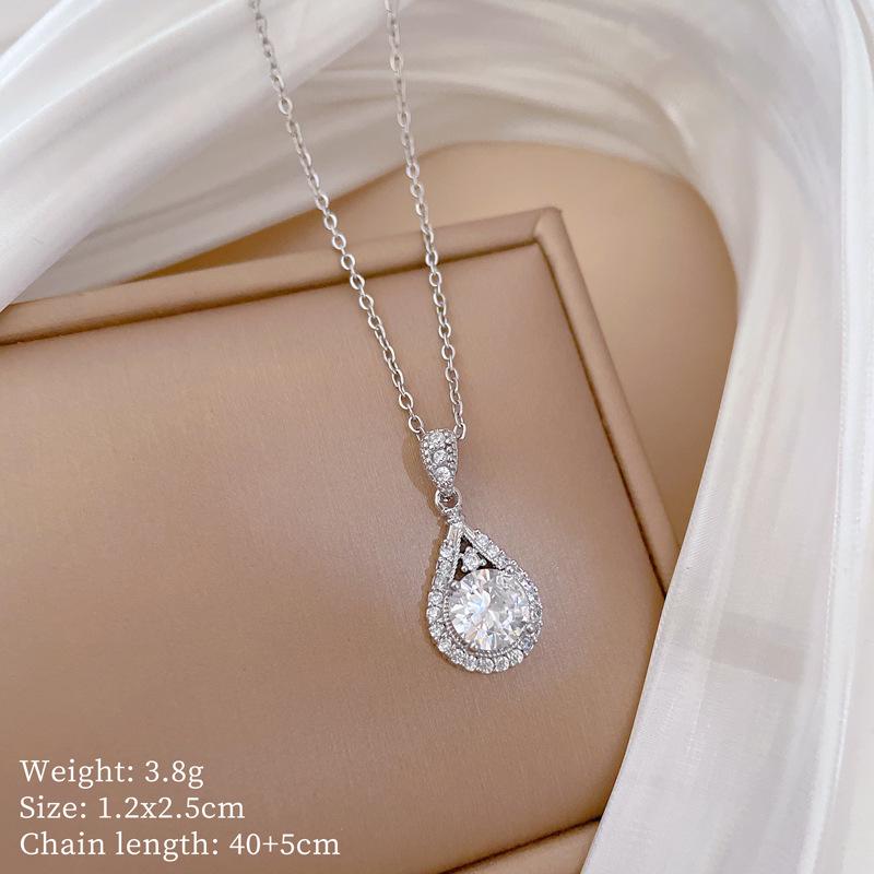 Titanium Steel Moon Pendant Necklace: Elegant Full Diamond Micro-Pave Design, Sparkling and Stylish for Women.