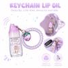 Julystar Cute Strawberry Keychain Lip Oil Moisturizing Clear Glossy Lip Plumper Fruit Flavor Lip Care Lip Gloss with Phone Cord Hair Tie Bag Pendant