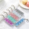 NEUER LED-Tastatur-Schlüsselanhänger Fidget Spielzeug Kristall Clicker Sensorisches Spielzeug zur Stressbewältigung Tastatur-Schlüsselanhänger Fidget Spielzeug für Erwachsene Kinder