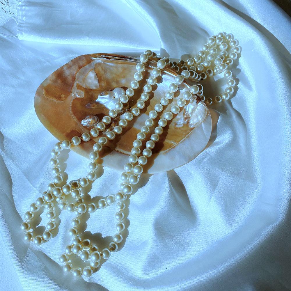 Elegant Retro Pearl Double-Layer Necklace: Small Fragrance Style, Versatile for Sweaters, Perfect Cross-Border Accessory for Women.