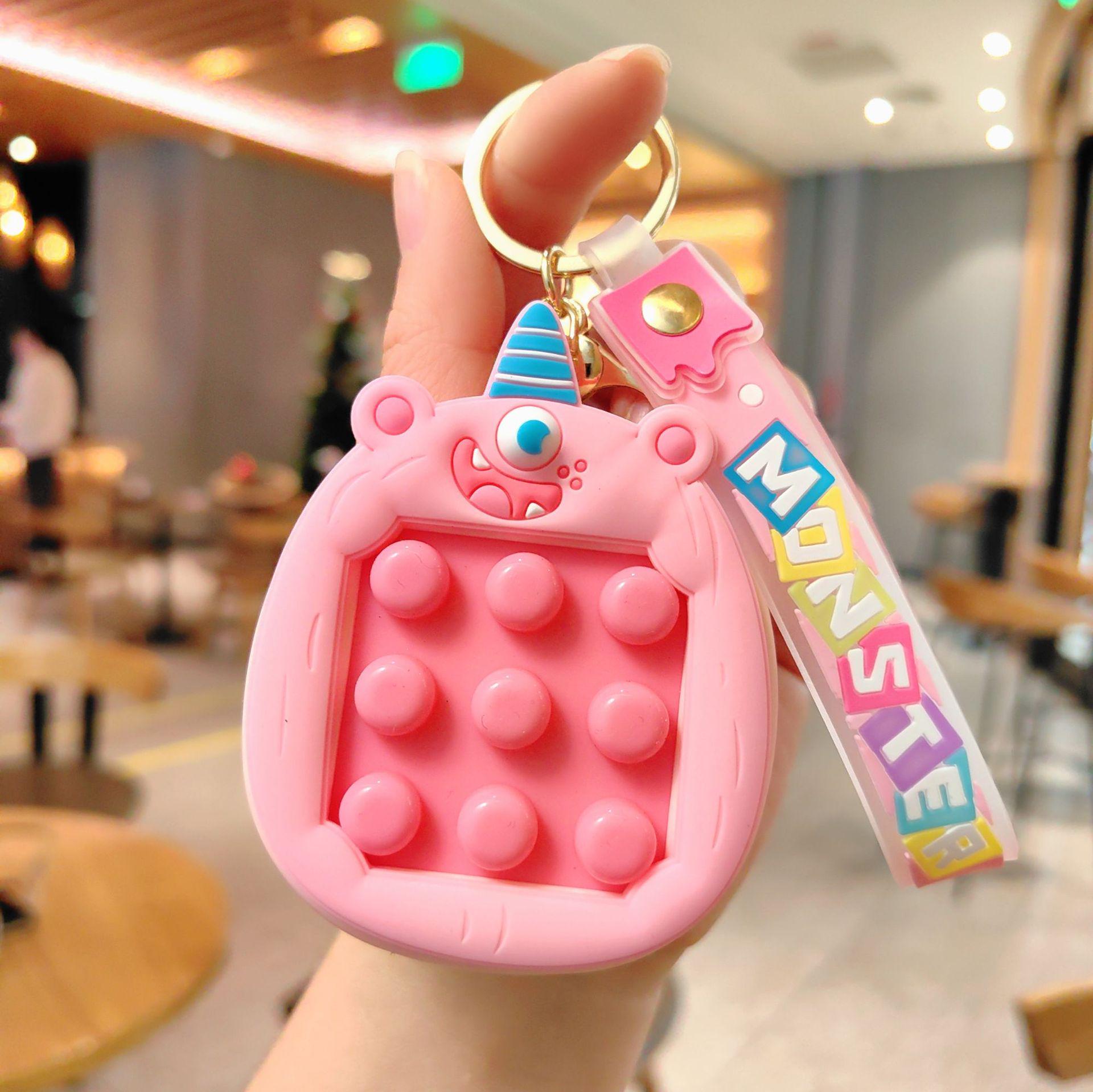 

Cute Monster Squeeze Keychain: Funny Cartoon Decompression Pendant for Kids Schoolbags & Car Keys рожевий